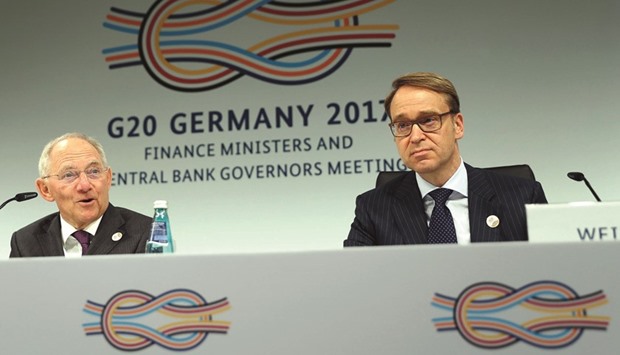 German Bundesbank President Jens Weidmann (right) and German Finance Minister Wolfgang Schaeuble address a news conference at the G20 Finance Ministers and Central Bank Governors Meeting in Baden-Baden, Germany. The worldu2019s financial leaders rowed back on a pledge to keep an open and inclusive global trade system after being unable to find a suitable compromise with an increasingly protectionist United States.
