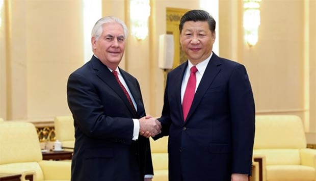 Chinese President Xi Jinping shakes hands with US Secretary of State Rex Tillerson before their meeting at the Great Hall of the People in Beijing on Sunday.