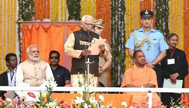 Prime Minister Narendra Modi looks on as the Governor of Uttar Pradesh state Ram Naik (centre) presides over the swearing-in ceremony of the new state government in Lucknow headed by Chief Minister Yogi Adityanath (right).