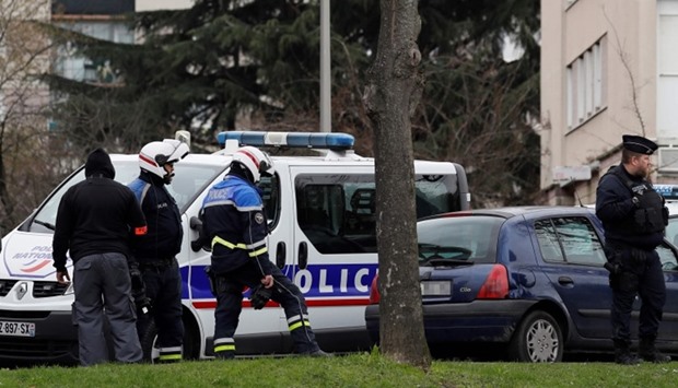 Police officers investigate at the house of the suspect of an attack at the Paris Orly airport