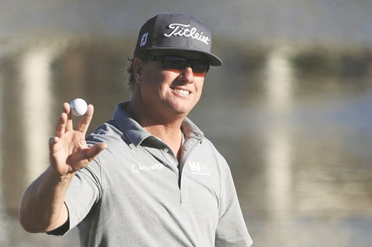 Charley Hoffman of the United States reacts after putting for birdie on the 18th green during the third round of the Arnold Palmer Invitational Presented By MasterCard at Bay Hill Club and Lodge in Orlando, Florida. (Getty Images/AFP)