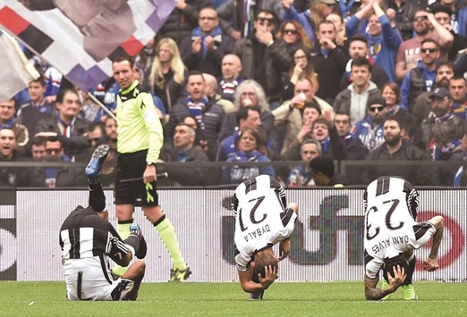 Juventusu2019 Juan Cuadrado (left) celebrates with teammates after scoring against Sampdoria during a Serie A match in Genoa, Italy. (Reuters)