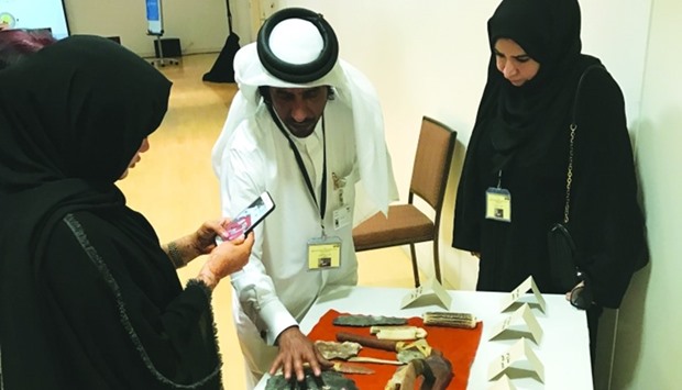 QMu2019s archaeology head Faisal Abdullah al-Nuaimi briefs two participants during the training programme which started on Sunday.