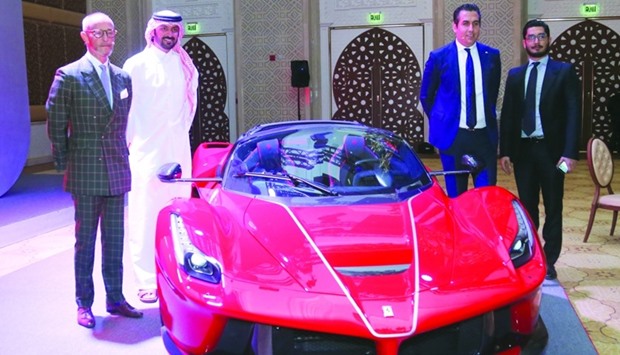 Ferrari MENA region general manager Giulio Zauner (left) and Charly Dagher (second, right) lead the unveiling of LaFerrari Aperta  at Marsa Malaz Kempinski as part of the iconic brand's 70th anniversary. PICTURE: Jayan Orma