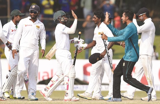 Bangladesh players celebrate their victory over Sri Lanka.