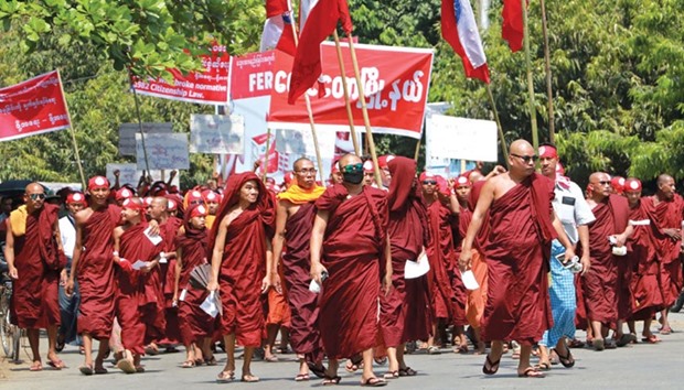 Monks and ethnic Rakhine protesters take part in a demonstration against a government push to speed up the citizenship verification process for the stateless Rohingya minority in Sittwe township, Rakhine state.