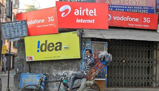 Billboards belonging to Indian telecommmunication companies are seen in Kolkata.