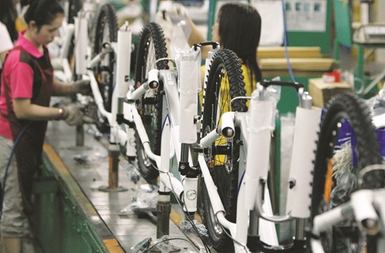 People work at the Giant bicycle factory in Taichung. Taiwanu2019s export orders surged 22% in February from a year earlier, its strongest pace since August 2010, when they expanded 23.3%, and were well above growth of 15.8% forecast in a Reuters poll.