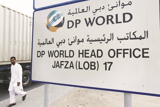 A man walks past a DP World sign in Dubai (file). The companyu2019s chairman said he expects growth in Latin America, Asia and Africa.