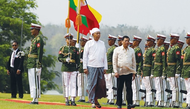 President Rodrigo Duterte is welcomed by Myanmaru2019s President Htin Kyaw in Naypyidaw yesterday.