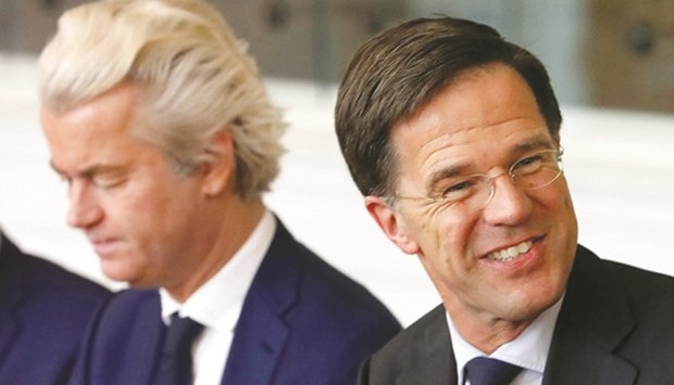 Dutch Prime Minister Mark Rutte, right, and far-right politician Geert Wilders at a meeting in parliament after the general election.