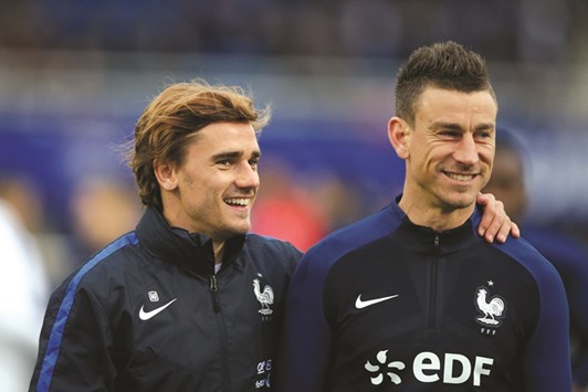 Franceu2019s Antoine Griezmann (left) and Laurent Koscielny at a training session yesterday. (AFP)