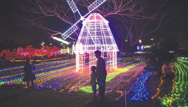 People visit the Myanmar International Lighting Festival in Yangon on Sunday night.