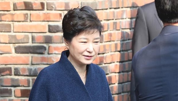 South Korea's ousted leader Park Geun-hye leaves from her private home as she heads to the prosecutors' office to be questioned over a widening corruption scandal in Seoul.