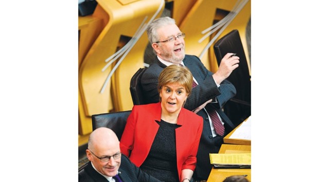 Scotlandu2019s First Minister Nicola Sturgeon reacts as she listens during the first day of the u2018Scotlandu2019s Choiceu2019 debate at the Scottish Parliament in Edinburgh yesterday.