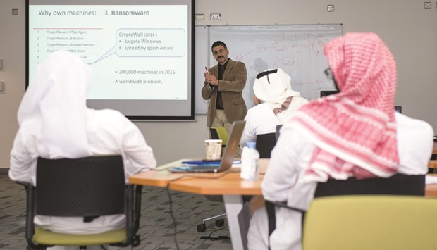 An expert gives an introduction to cyber security at the HBKU workshop.