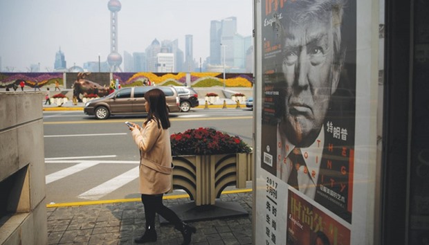 A Chinese magazine poster showing US President Donald Trump is displayed at a newsstand in Shanghai, China.