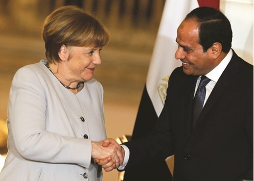 Egyptu2019s President Abdel Fattah al-Sisi and German Chancellor Angela Merkel shake hands following a news conference at the El-Thadiya presidential palace in Cairo.