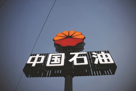 PetroChinau2019s logo is seen at its petrol station in Beijing. Chinaoil, a unit of PetroChina, in 2015 traded a record 151mn tonnes, or roughly 3mn barrels per day of crude oil and refined fuel, versus 22mn tonnes in 2001, posting yearly average growth of 15% over that time span, according to its website.