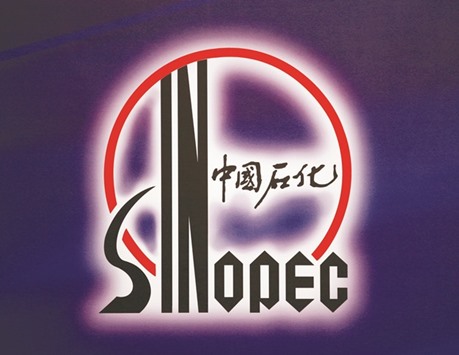 The logo of Sinopec is displayed in Hong Kong. The Chinese firm in 2012 partnered South Africau2019s national oil company PetroSA to help develop a new greenfields refinery that has subsequently been shelved due to high costs.