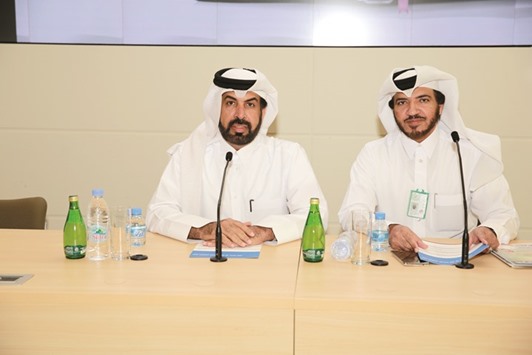 Al-Mansoori and al-Abdulqader addressing the educational day at the College of Business and Economics.