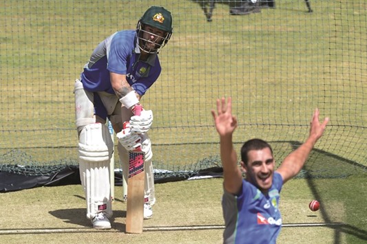 Australiau2019s Mitchell Starc (right) reacts after bowling to Matthew Wade during a net practice session prior to the second Test against India in Bangalore yesterday. (AFP)