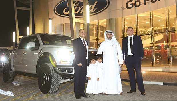 Almana Motors Company officials hand over a new Ford F-150 Raptor to a customer on Tuesday. PICTURE: Noushad Thekkayil