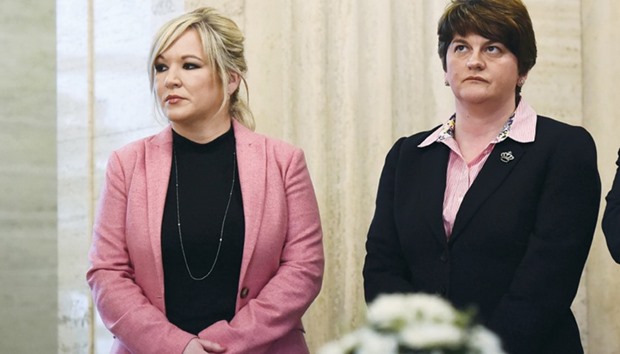 Sinn Feinn leader Michelle Ou2019Neill and Arlene Foster, leader of the Democratic Unionists, watch as members of the Northern Ireland Assembly sign the book of condolences for Martin McGuinness who died yesterday, in Stormont, Belfast, Northern Ireland.