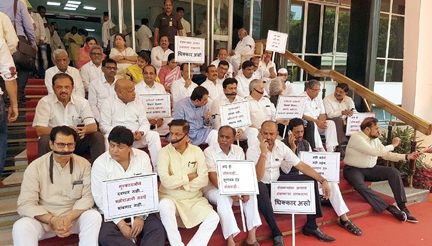 Maharashtra opposition leaders stage a demonstration outside the assembly in Mumbai yesterday.