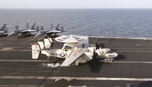 An E-2 Hawkeye lands on the flight deck of the US aircraft carrier, USS George HW Bush in the Gulf of Oman.