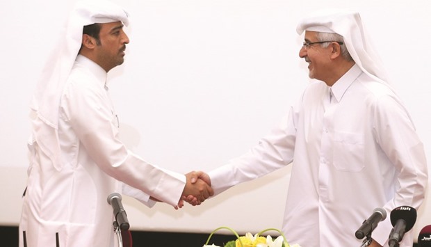 Brig Khalifa Abdullah al-Noimi and Dr Khalid Abdulnoor Saifeldeen shake hands after signing the agreement. PICTURE: Jayan Orma
