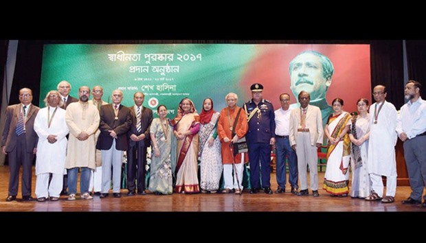 Prime Minister Sheikh Hasina with recipients of the Independence Award 2017, the highest state award, to Bangladesh Air Force and 15 distinguished personalities, including 1971 veterans.