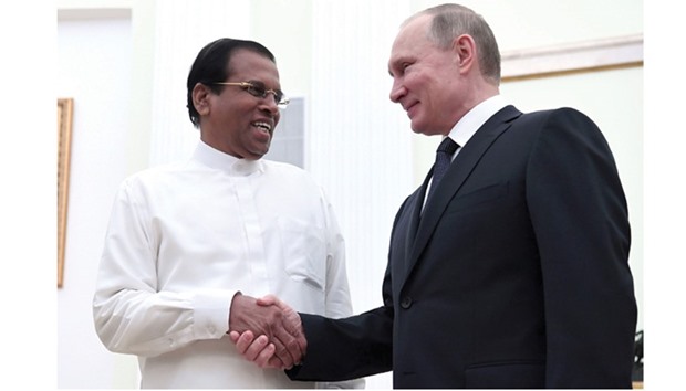 Russian President Vladimir Putin welcomes his Sri Lankan counterpart Maithripala Sirisena during their meeting at the Kremlin in Moscow yesterday.