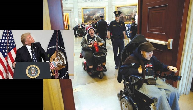 Trump: has suggested that he could single out lawmakers and make their lives difficult if they defy him.  RIGHT: US Capitol police arrest demonstrators in wheelchairs protesting against the AHCA bill put forward by Trump and Congressional Republicans. Several dozen protesters were taken into custody after refusing to leave the rotunda of the US Capitol in Washington on Wednesday.