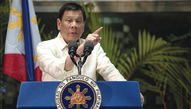 President Rodrigo Duterte gestures as he answers questions from the media at Manila International Airport yesterday.