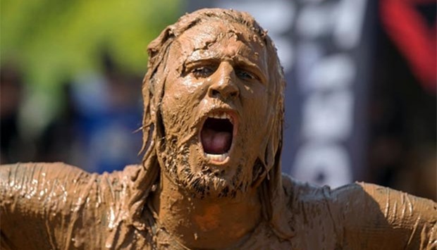 A man takes part in the first Mud Day Israel obstacle course race in Tel Aviv on Friday.