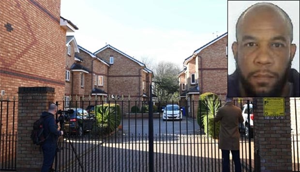 A police car is parked outside a house in a gated housing estate in West Didsbury, north west England connected to Westminster terrorist Khalid Masood (inset) which was raided overnight by anti-terror police on Friday.
