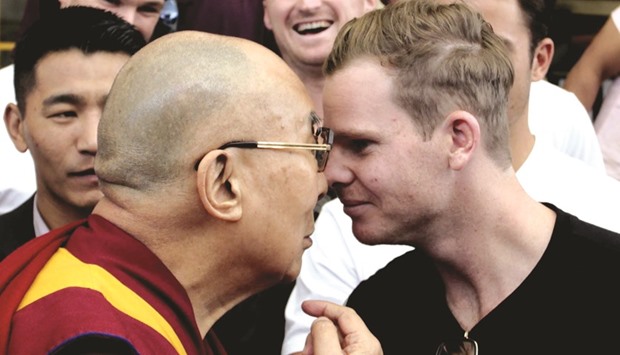 Tibetan spiritual leader Dalai Lama greets Australian cricket captain Steve Smith at his residence in Dharamsala, India. (AFP)