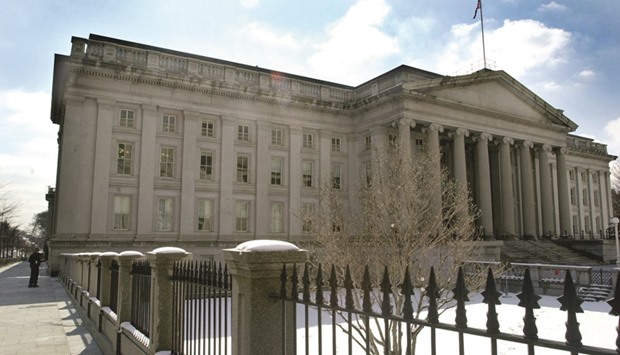The US Treasury building is seen in Washington, DC. Treasury bond yields are set to rise this year, but not as much as many currently expected, according to a Reuters poll of top fixed-income strategists who appear sceptical the Federal Reserve will manage to raise rates several times more this year.