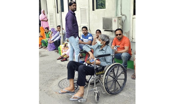 People wait outside the Sir Ganga Ram Hospital as doctors go on strike to press for implementation of Violence Against Doctors Act, 2010, in New Delhi yesterday.