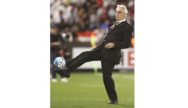 Qatar coach Jorge Fossati (top ) and his Iran counterpart  Carlos Queiroz react during the match on Thursday.