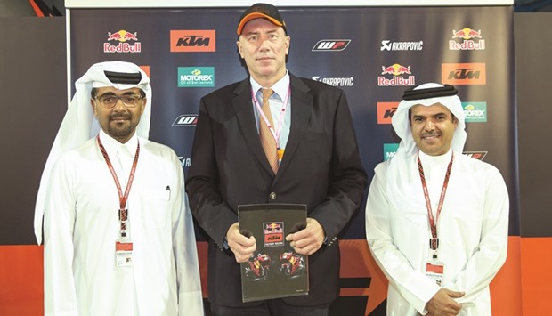 Austriau2019s ambassador to Qatar Willy Kempel (C) with QMMF President Abdulrahman al-Mannai (L) and Vice President and GM of Losail Circuit Sports Club, Khalid al-Remaihi.