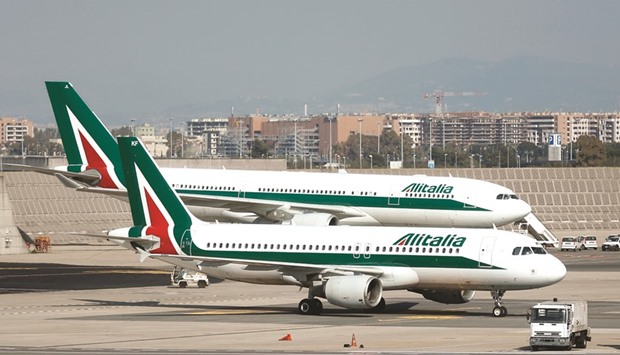 Alitalia aircraft stand on the tarmac at Fiumicino airport in Rome. Italy is  considering emergency financing for Alitalia as the carrier risks running out of cash in a few weeks because investors and creditors are reluctant to fund a new rescue plan without a labour agreement on job cuts.