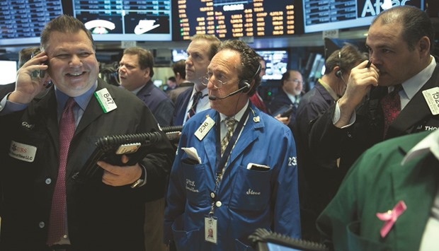 Traders work on the floor of the New York Stock Exchange. The death of the Republican healthcare reform may not prove to be the knife to the heart of the bull market some had feared, but to keep the Trump trade alive investors should temper expectations for the breadth of expected tax cuts.