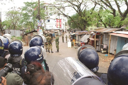 Bangladesh police and army commandos take part in an operation to storm an extremist hideout in Sylhet, 246km from Dhaka, yesterday.