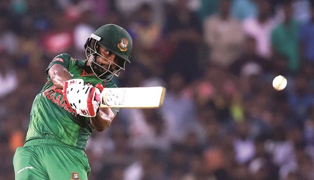Bangladesh batsman Tamim Iqbal plays a shot on way to his century against Sri Lanka at The Rangiri Dambulla International Cricket Stadium in Dambulla yesterday.