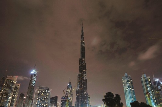 The lights on the Burj Khalifa tower are switched off for an hour in Downtown Dubai, yesterday, as iconic landmarks and skylines are plunged into darkness as the u201cEarth Houru201d switch-off of lights around the world got under way to raise awareness of climate change.