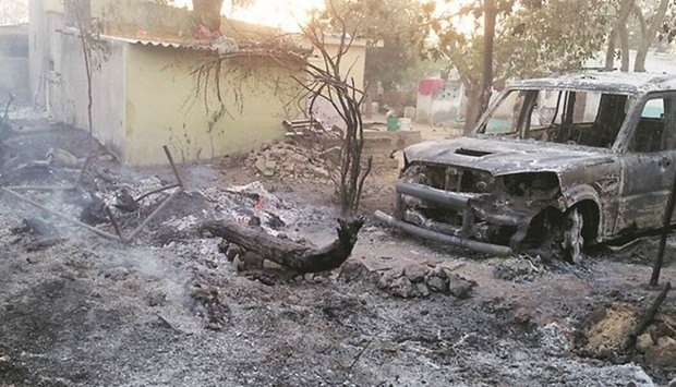 A car burned down by the mob in Vadavali village, Gujarat. Picture courtesy: Indian Express