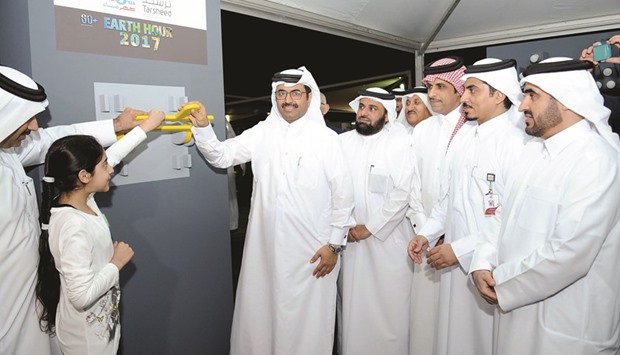 Lights were switched off at many government establishments, private entities and hotels in the country for an hour from 8.30pm to 9.30pm yesterday as part of Earth Hour celebrations. At Qatar General Electricity and Water Corporationu2019s (Kahramaau2019s) Awareness Park in Thumama, HE the Minister for Energy and Industry Dr Mohamed bin Saleh al-Sada (pictured) led the celebrations by switching off power in the presence of several senior officials of the corporation, including president Issa Hilal al-Kuwari.  PICTURE: Nasar T K