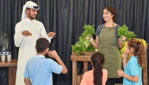Local vegan restauranteur Ghanem al-Sulaiti briefs young students about healthy foods